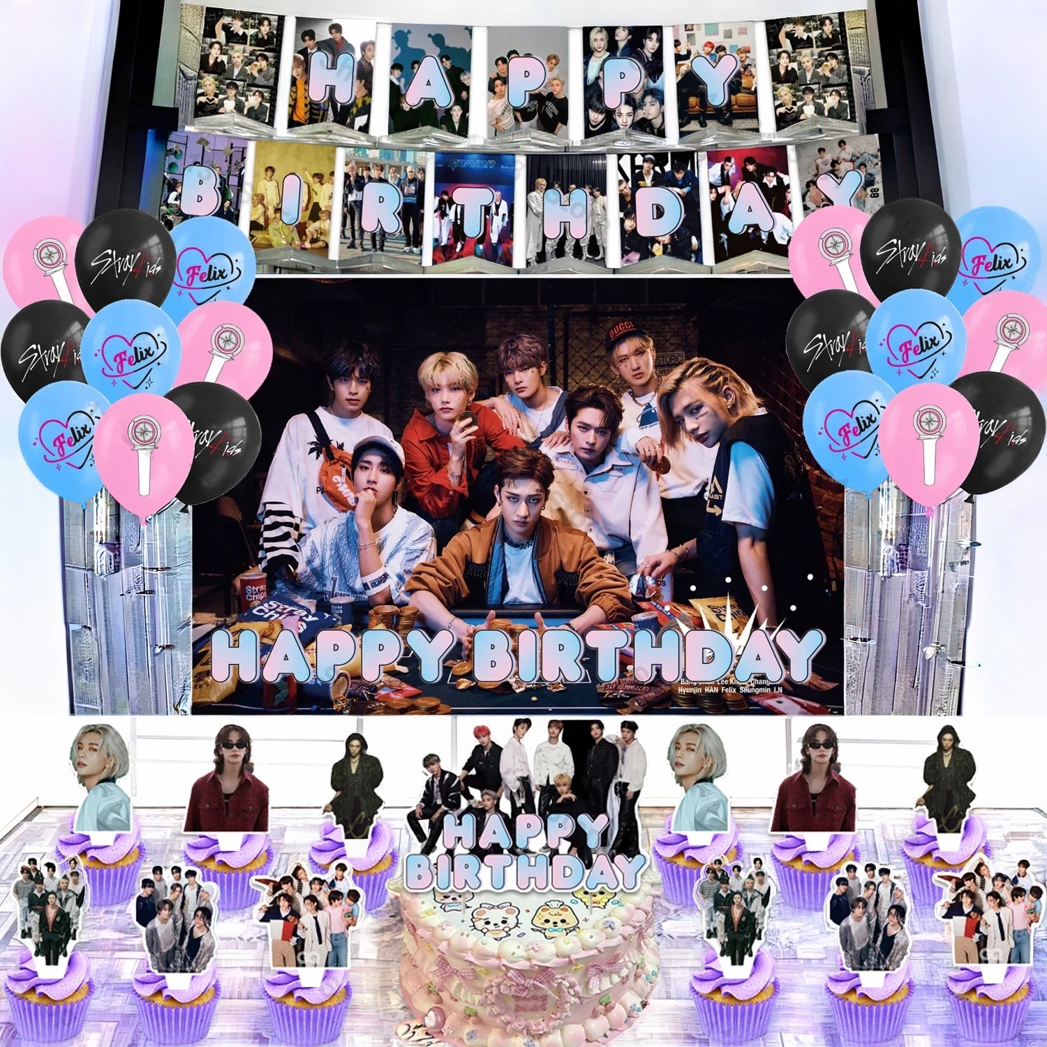 Ensemble d'articles de fête d'anniversaire Stray Kids illustrant une grande toile de fond avec les membres du groupe, une banderole à fanions lettrée Happy Birthday, un assortiment de ballons roses, bleus et noirs avec logos et lightsticks, ainsi qu'un grand cake topper et plusieurs petits pics pour décorer des cupcakes.